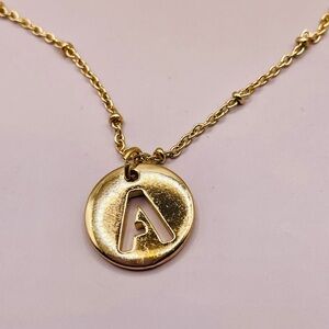 Gold Necklace with Circular Pendant and Engraved Letter A. 18 inches long